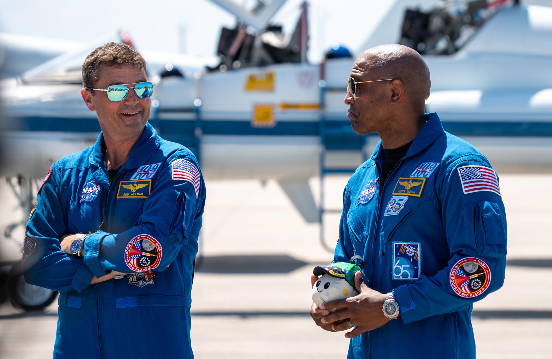 These images show the moments shortly after the arrival of the Artemis II crew to NASA’s Kennedy Space Center on March 27, 2026 ahead of the launch. The four astronauts, Victor Glover, Reid Wiseman, Christina Koch, and Jeremy Hansen, arrived on a T38, which can be seen behind them. They took turns speaking to the crowd as they also announced the zero-gravity indicator they would be taking with them on their journey.